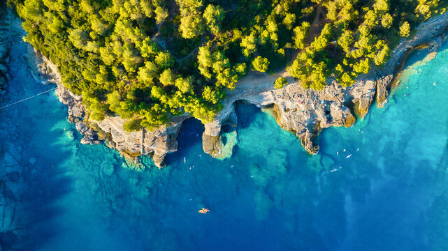 Drone view of the sea coast. Rocky shore and sea water. Vacation and travel. Summer seascape. aerial view. Image for cards, background, wallpaper or design.