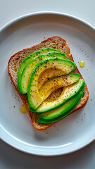 Wall Mural - Avocado Toast on White Plate. Healthy Snack, Vegan Breakfast, Simple Meal.