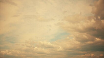 Wall Mural - Sky at sunset. Clouds illuminated by the yellow-orange sun. Calm romantic background on the theme of inspired dreams.