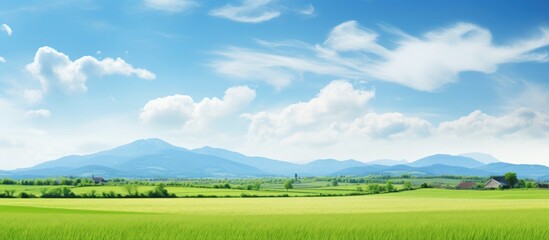 a breathtaking springtime scene of a rural landscape with majestic mountains in the distance the vas