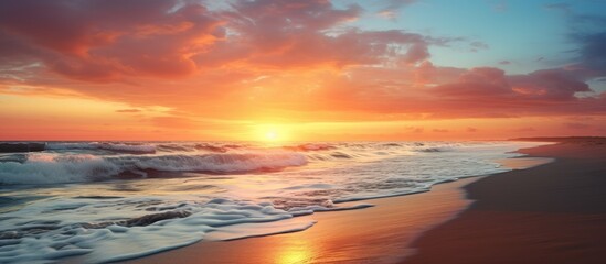 Poster - Beautiful sunset at the beach with a mesmerizing view of the sun disappearing into the horizon creating a serene ambiance Perfect for a copy space image
