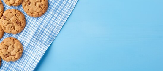 Aufkleber - Top view of oatmeal cookies with a blue background accompanied by a white napkin Represents a concept of nutritious breakfast or snack Copy space image