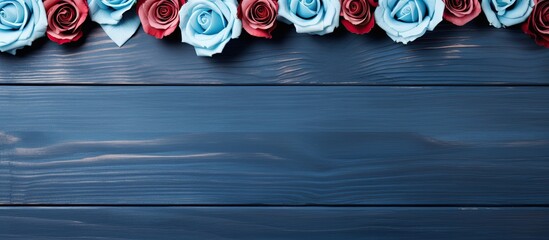 Poster - The Valentine s Day background features a wooden blue backdrop adorned with a frame made of roses flowers This flat lay view offers a top perspective leaving ample copy space