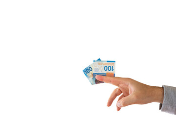 One one hundred Swiss francs cash banknote or bill held by Caucasian male hand. Close up studio shot, white background