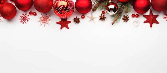 Aufkleber - A festive Christmas background with vibrant red decorations arranged on a crisp white backdrop showcased in a flat lay style providing ample copy space for additional elements