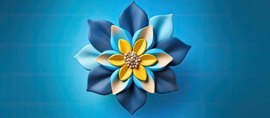 Poster - A gingerbread flower with vibrant blue and yellow petals stands out against a colorful background leaving enough space for additional elements or text