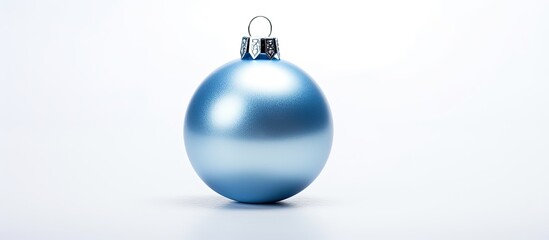 Poster - A silver and blue Christmas ornament placed on a white background providing ample space for additional text or images The ornament is arranged in a flat lay style