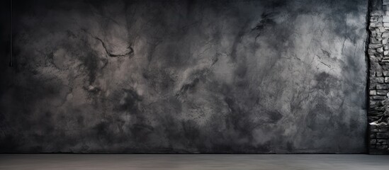 Wall Mural - An artistic wallpaper with a textured abstract and grungy black concrete wall serving as a backdrop It provides a rough and decorative surface with ample copy space for creative uses