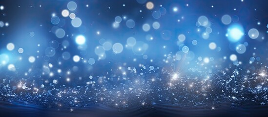 Poster - a magical blue bokeh with blinking stars and falling snowflakes creates an abstract christmas backgr