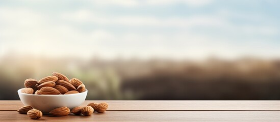 A satisfying almond snack on a wooden table creates a peaceful moment during office breaks allowing for relaxation and rejuvenation The area around the snack acts as a blank space to capture images