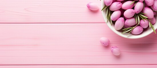 Poster - A pink olives and fresh rosemary arrangement in a small bowl is presented on a light wooden background The image is in a long banner format and is taken from a top down perspective. Creative banner