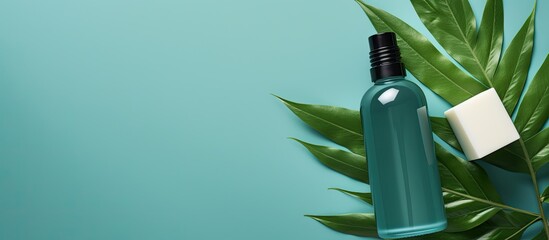 Aufkleber - An organic cosmetic product photo of a green bottle with green leaves on a blue background ideal for spa salon beauty skincare Template including a mockup with a flat lay composition and copy space