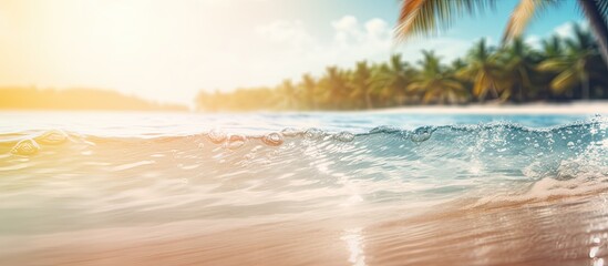 Poster - There is a blurred tropical beach with bokeh sunlight and wave abstract background creating a vintage tone filter effect for a copy space image representing an outdoor summer vacation and travel adve
