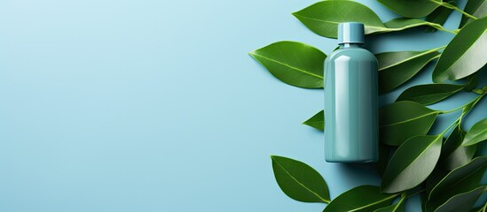 Aufkleber - An organic cosmetic product photo of a green bottle with green leaves on a blue background ideal for spa salon beauty skincare Template including a mockup with a flat lay composition and copy space