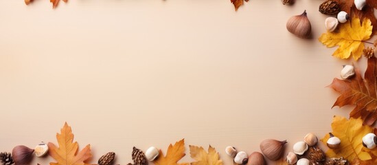 Wall Mural - Fall themed flat lay composition with a border of dried oak leaves and acorns on an autumn background Ideal for Thanksgiving day or seasonal concepts with ample copy space for additional design eleme
