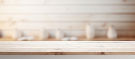 Poster - A white wooden table sits empty against a blurred interior background providing a clean and versatile copy space image with a white color tone