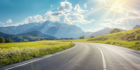 Empty highway in the middle of flowering meadows, steep mountain peaks in the background, clear sunny day, bright rays, incredible nature