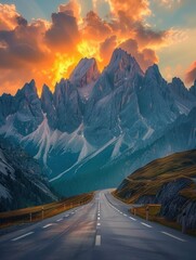 Wall Mural - Empty highway on the background of mountain peaks in the Italian Alps, a lake in a gorge, sky illuminated by the sun rays at sunset