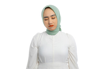 Wall Mural - Beautiful young Asian woman in green hijab and white blouse crying with sad and depressed expression isolated on white background