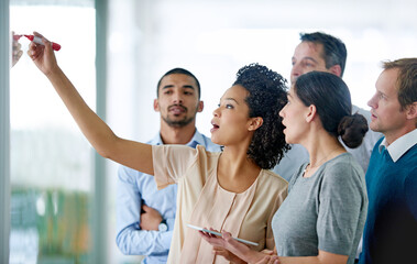 Wall Mural - Creative people, writing and tablet with glass board for schedule planning, tasks or agenda at office. Group of business employees taking notes for discussion, brainstorming or startup at workplace