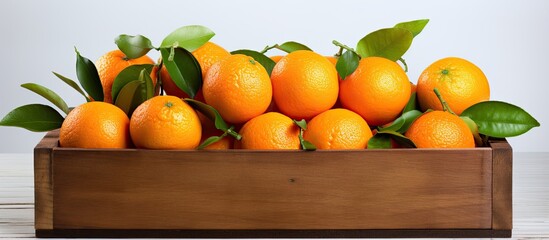 Aufkleber - Juicy ripe Italian tangerines o clementines in a wooden box on a white background. Creative banner. Copyspace image