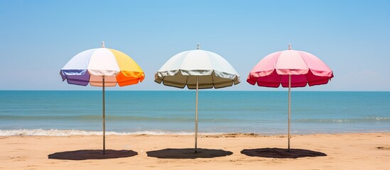 Wall Mural - recreation concept beach umbrella lying on sandy beach. Creative banner. Copyspace image