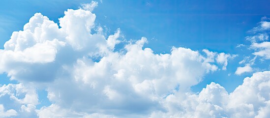 Poster - white clouds on a blue sky day. Creative banner. Copyspace image