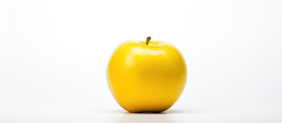 Poster - Single a yellow apple Isolated on white background Close up Studio photography. Creative banner. Copyspace image