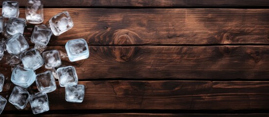Aufkleber - The ice cubes in glass with water bottle on the old wooden table. Creative banner. Copyspace image