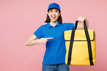 Sticker - Professional delivery girl employee woman wearing blue cap t-shirt uniform workwear work as dealer courier point on yellow thermal food bag backpack isolated on plain pink background. Service concept.