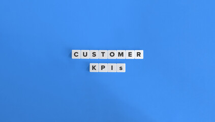 Wall Mural - Customer KPIs (Key Performance Indicators). Customer Satisfaction (CSAT), Net Promoter Score (NPS), Customer Retention Rate, Customer Lifetime Value (CLV). Text on Block Letter Tiles.