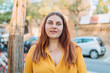 © mdyn - Portrait of beautiful cute woman on urban background. Young woman smiling confident standing at street