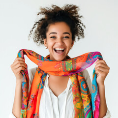Wall Mural - Woman with a bright scarf on white background, smiling and laughing