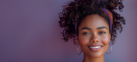 Wall Mural - A woman with curly hair and a purple headband. She is smiling and looking at the camera. a candid smiling modern south African woman on a plain lilac background