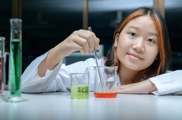 Wall Mural - little scientists manned chemicals in beakers. science and education
