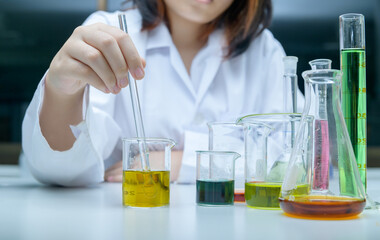 Wall Mural - little scientists manned chemicals in beakers. science and education