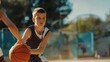 © PaulShlykov - Boy with a basketball leaning against school gym