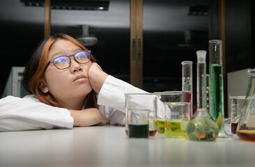 Wall Mural - girl scientist oring lesson of chemistry. emotion of education