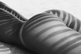 Shadow Patterns of Palm Tree on Bare Skin in Black and White