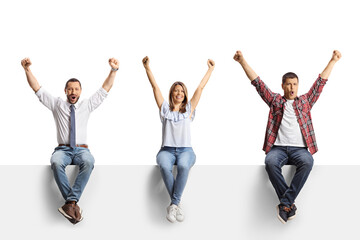 Wall Mural - Excited men and a woman with arms up sitting on a blank panel