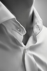 Poster - A close-up shot of a person wearing a white shirt, suitable for use in various contexts