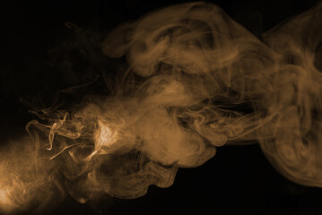 Wall Mural - Yellow steam on a black background.