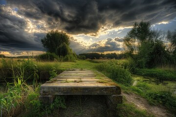 Aufkleber - A rustic wooden bridge spanning a tranquil small stream in an open field, perfect for use in rural or countryside scenes