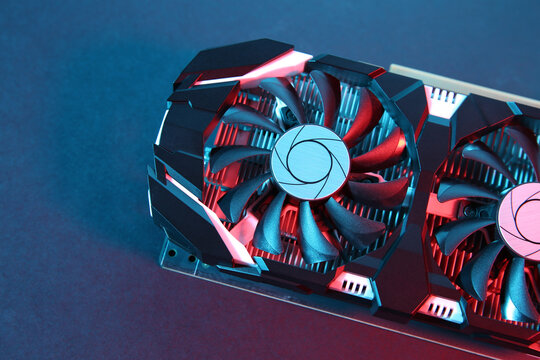 Computer graphics card on color background, top view. Space for text
