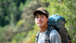 © RealityForge - Gen-z young Asian-American man hiking in the California wilderness in the summer.