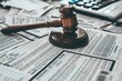 © Fotograf - A wooden gavel sits atop a stack of papers, ready for use in a meeting or official setting