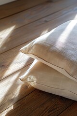 Aufkleber - Three pillows sitting on a wooden floor, simple and clean interior scene