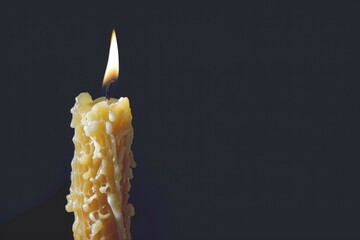 Poster - A single flame illuminates the surrounding darkness