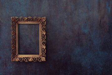 golden metal frame mockup on a wall