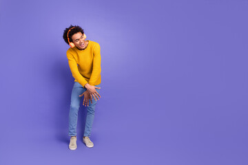 Sticker - Photo of cheerful positive nice man wear stylish yellow clothes have fun look empty space isolated on purple color background